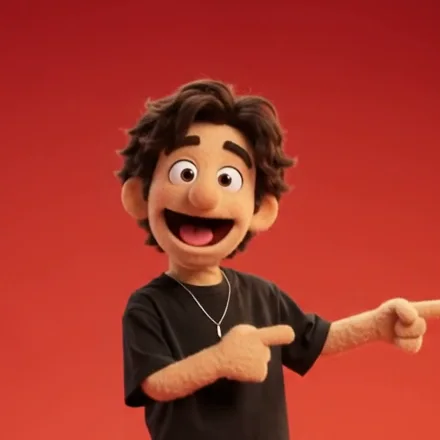 Usman's felt puppet laughing and pointing.